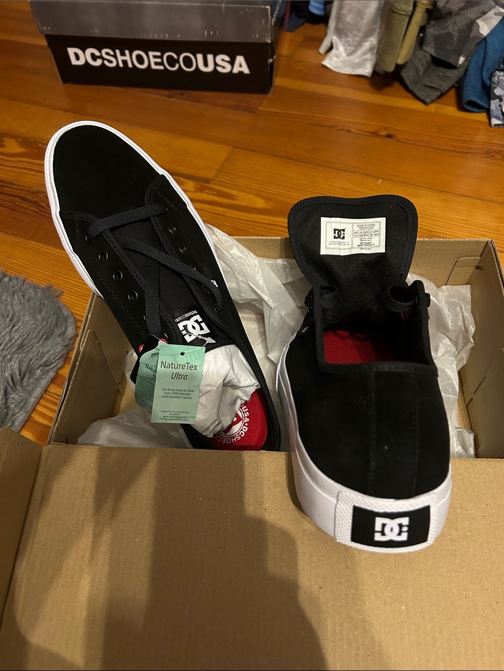 DC Black Suede Low-Top Skate Shoes with White Sole and Red Lining